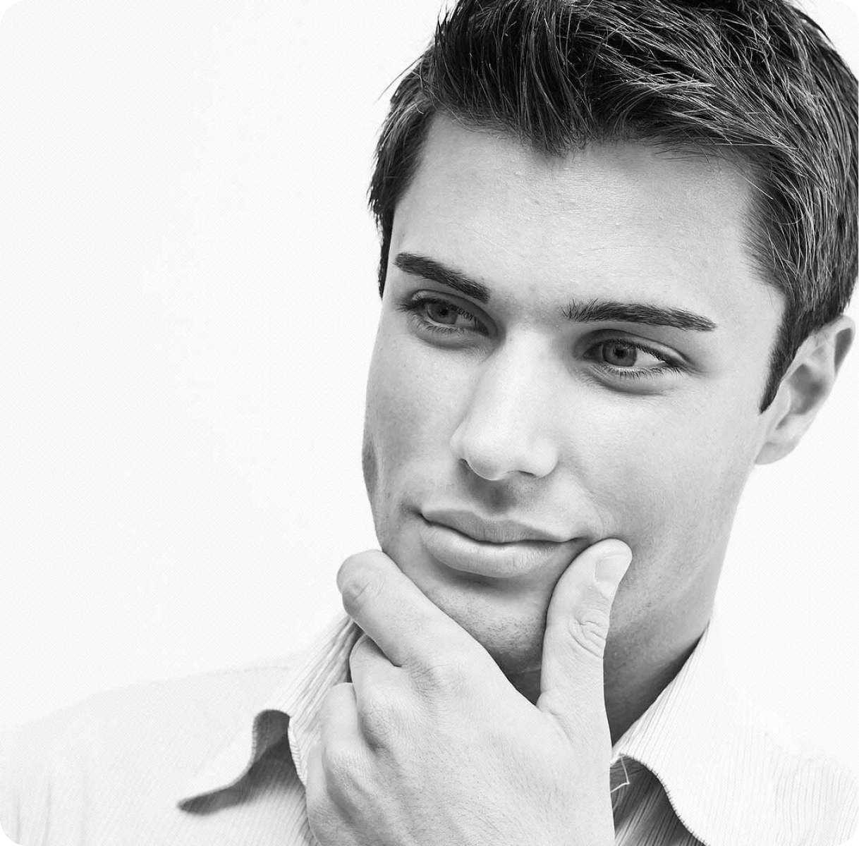 Man pondering with hand on chin